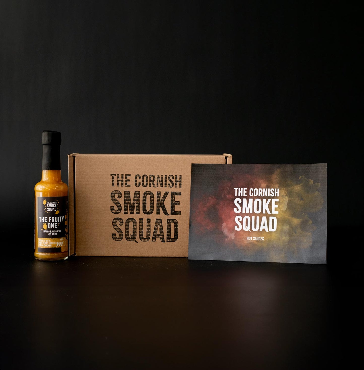Mango and habanero hot sauce known as 'The Fruity One' next to a giftbox