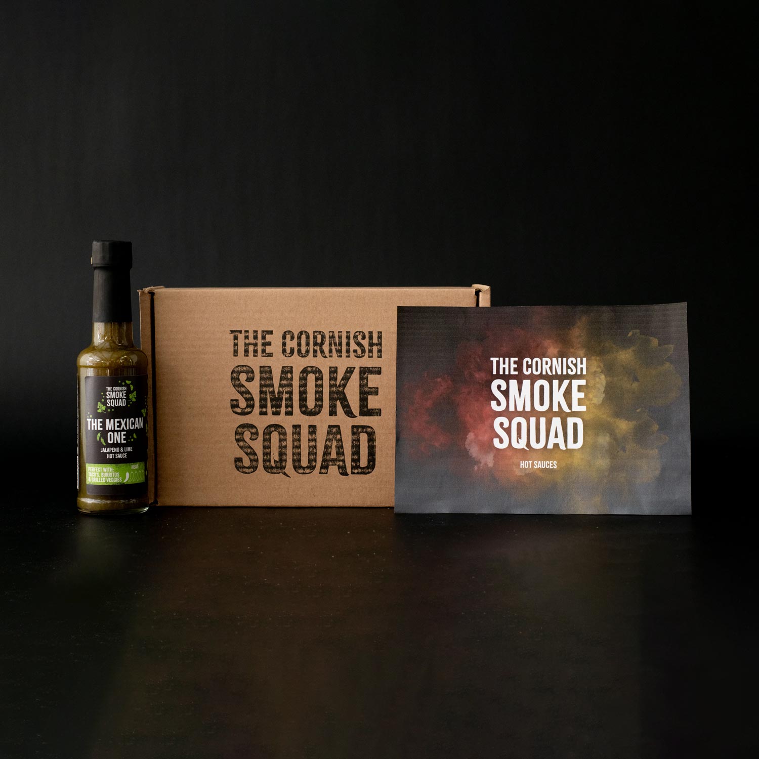 Jalapeño and lime hot sauce stood next to giftbox