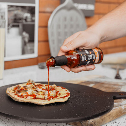 Peri Peri hot sauce poured over flatbread