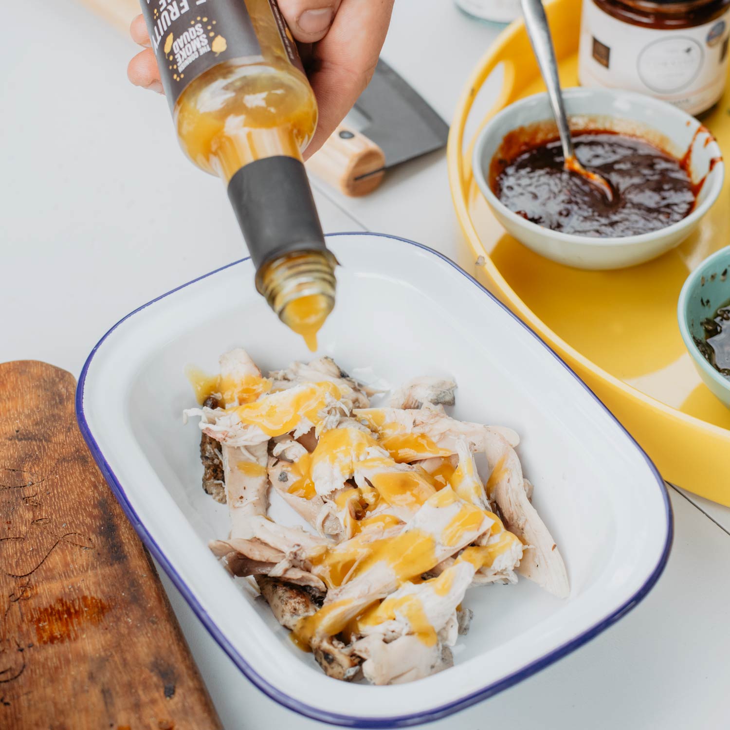 mango and habanero hot sauce gets poured over pulled chicken
