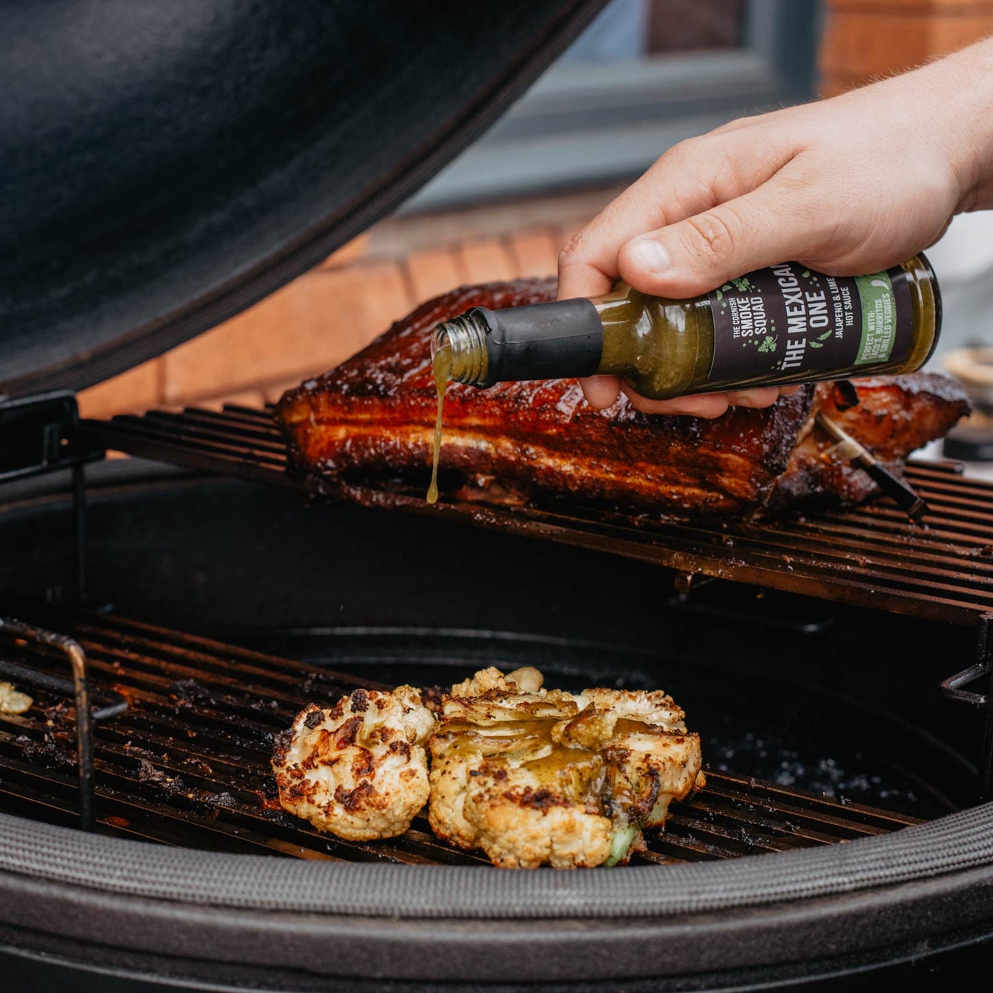 Jalapeño and lime hot sauce poured over BBQ cauliflower