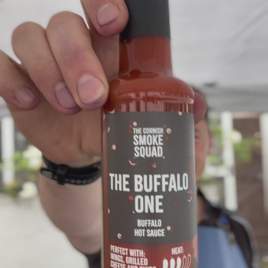 The making of buffalo chicken burgers on a BBQ