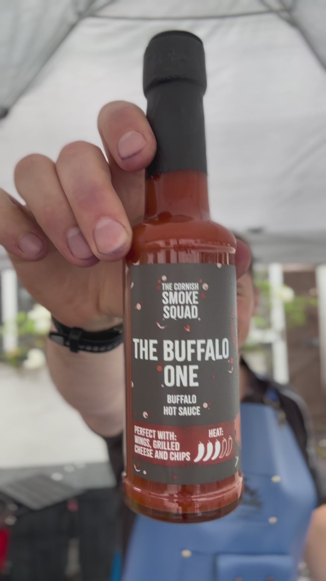 The making of buffalo chicken burgers on a BBQ
